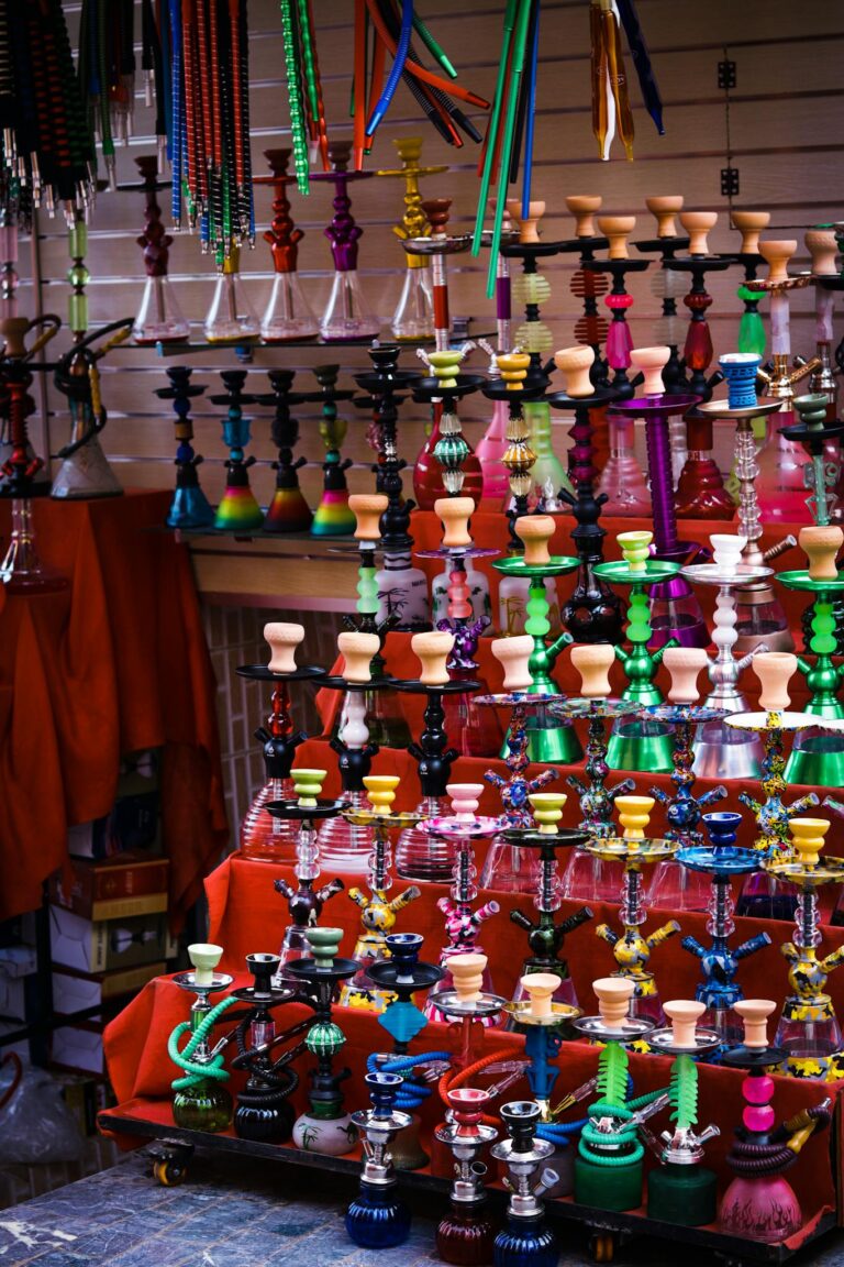 Vibrant hookahs on display at a market in Oujda, Morocco, showcasing traditional and colorful designs.